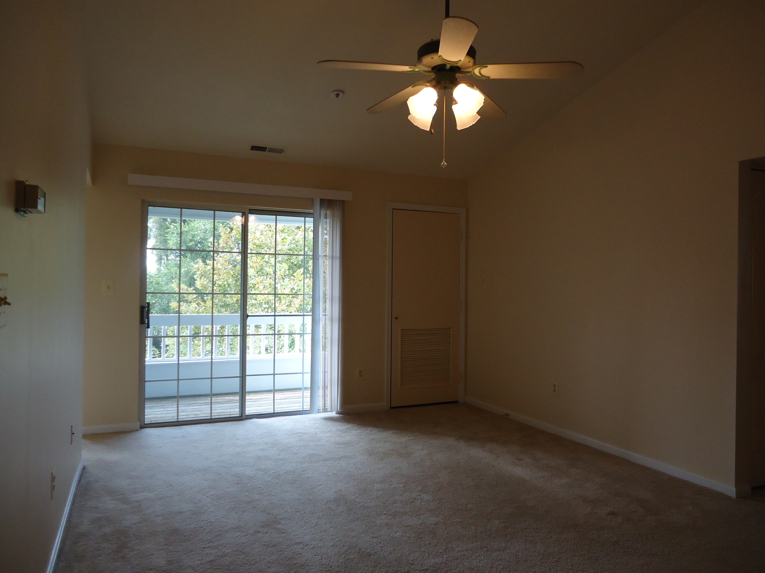 Living Room With Sliders To A Balcony