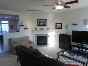 Living Room With Gas Fireplace and Granite Surround