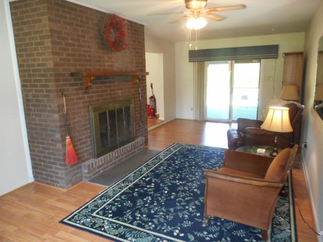 FAMILY ROOM WITH TWO SIDED WOOD BURNING FIREPLACE